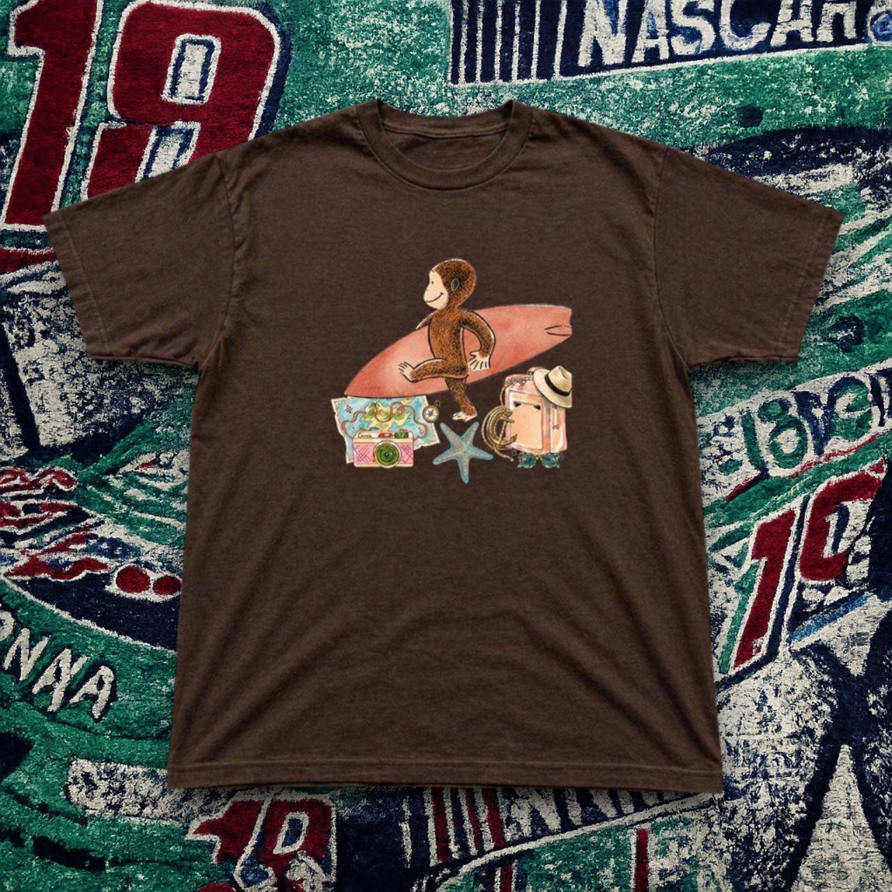 Curious George Surf Trip Graphic Brown T-Shirt Cute Cartoon Beach Vibes Tee.
